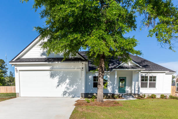 istock Exterior facade of a white new construction house 1223041319