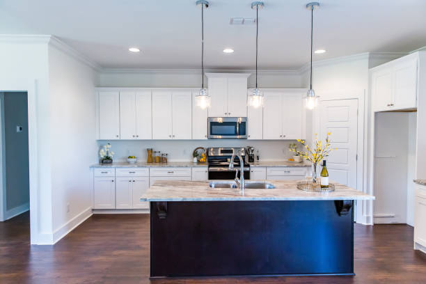 istock New construction modern kitchen with white cabinets and hardwood floors 1223041353