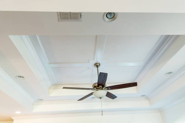 istock White tray ceiling in small new construction house with windows and a fan 1223041985