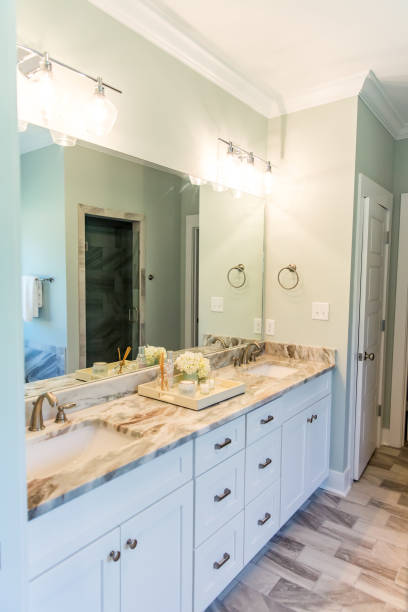 istock Modern new construction home house bathroom with granite countertops and a tile floor and double sinks 1223042009
