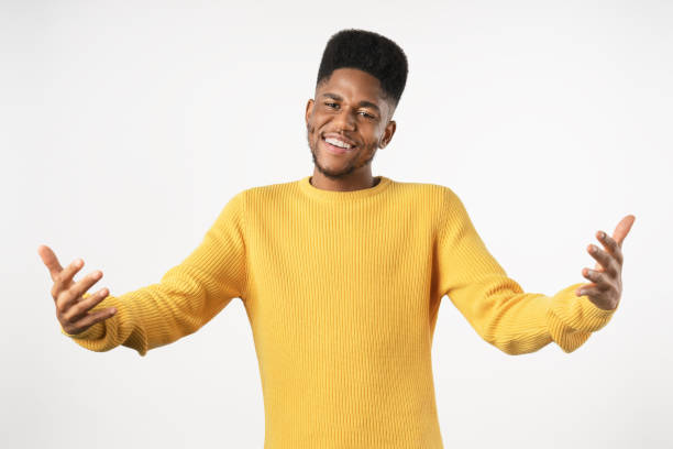 istock Young african man feels confident giving a hug isolated on white background 1223042355