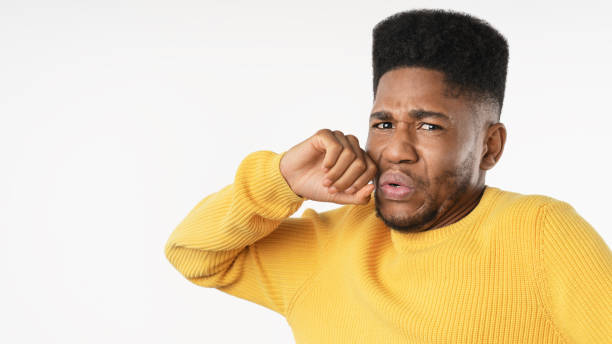 istock Close up of young man with disgusted expression repulsing something over white background 1223042356