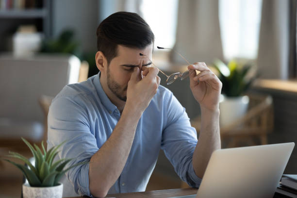 istock Tired exhausted businessman massaging nose bridge, feeling eyestrain 1223044317
