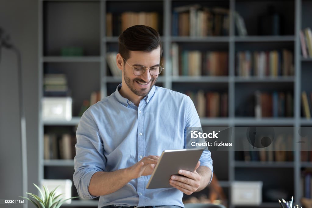 Man With Glasses Using Computer Smiling Businessman Wearing Glasses Using Computer Tablet In Modern ...