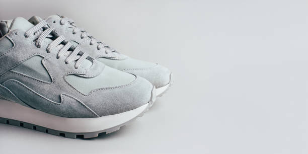 istock Gray sneakers on a gray background. 1223047856
