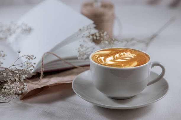Cappuccino for design concept. Hot drink. Morning drink. Reading of books. Morning reading. Work at home