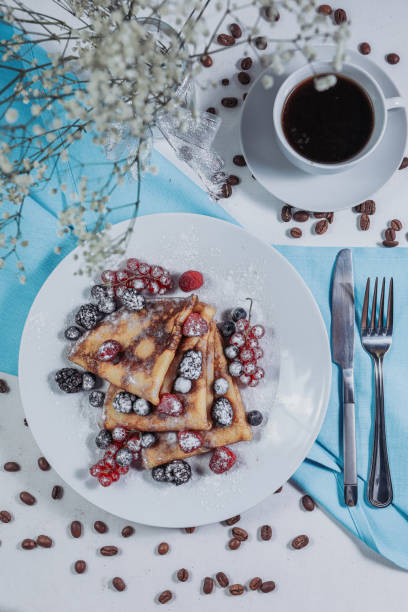 istock Golden pancakes for breakfast. Blue napkin. Morning drink. 1223048271