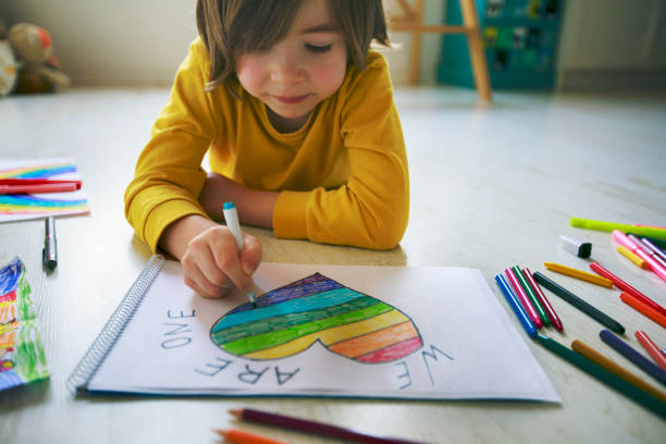 istock Happy boy drawing heart at home. Hope - concept. 1223048564