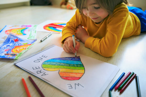 istock Happy boy drawing heart at home. Hope - concept. 1223048710