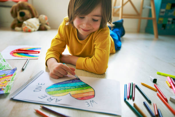 istock Happy boy drawing heart at home. Hope - concept. 1223048737