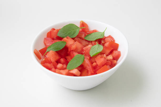 istock Chopped or Diced Tomatoes in a bowl with basil 1223049495