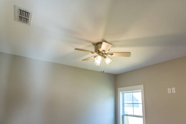 istock Light color empty bedroom in a new construction house with a ceiling fan 1223049512