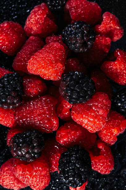 Close-up on a dark background. Red berry closeup. Vegetarian healthy food.