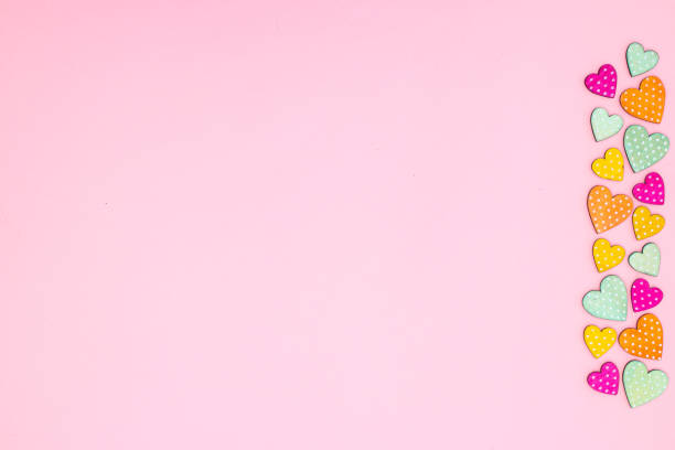 istock Hearts on right side of pink background 1223052034