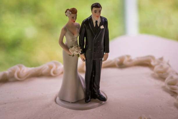 istock Wedding cake topper on a wedding cake in the summer 1223052160