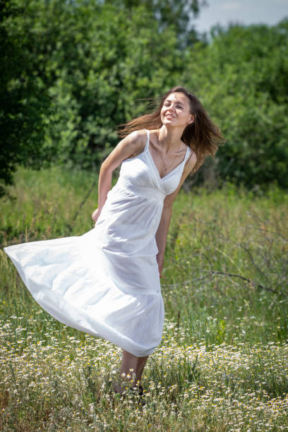 istock Young woman in white dress 1223052494
