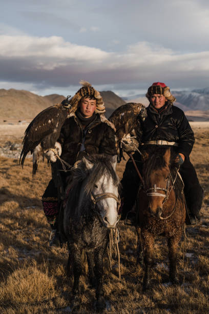 istock Two eagle hunters  near the river in Mongolia 1223053260