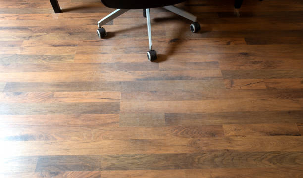 istock Damaged Laminate Floor from office chair wheels in a home, needs protection 1223053276