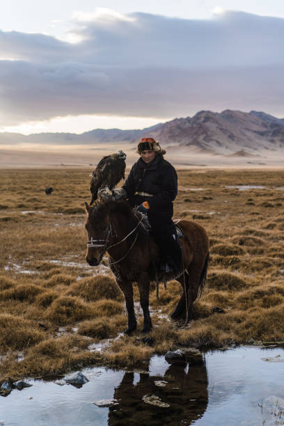 istock Eagle hunter near the river in Mongolia 1223053310
