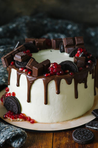 istock Cake decorated with chocolate drips, chocolate chips, pomegranate and chocolate chip cookies. 1223053453