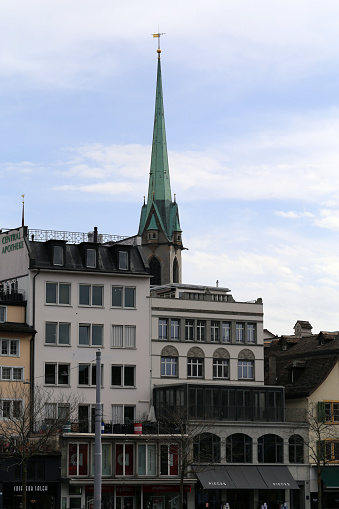 Old architecture of old town in downtown Zürich, Switzerland, March 2020. Beautiful old buildings with a lot of architectural details and sky with some white clouds. Color image.