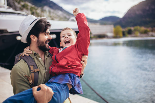 istock Happy father hugging little son arriving returning after long trip 1223055413