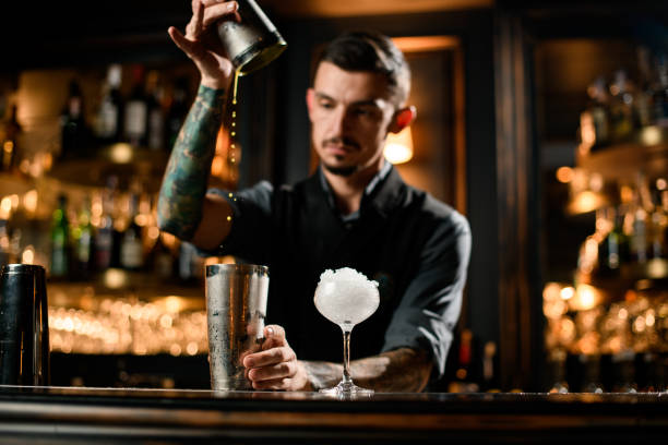 istock Male bartender cooking cocktail with special bar equipment 1223056476