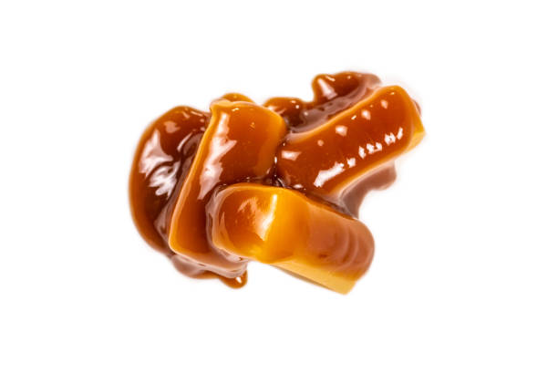 istock Tasty caramel candy isolated on white background. 1223056784