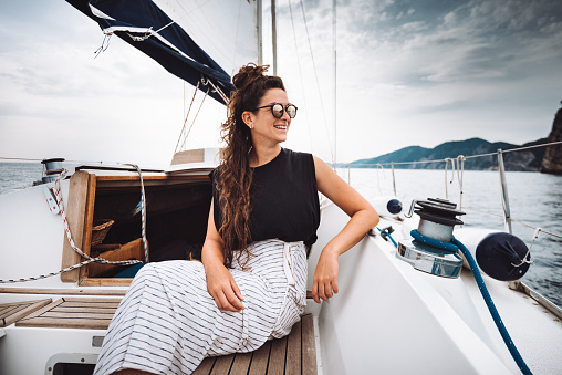 woman traveling with a sailing boat in Italy