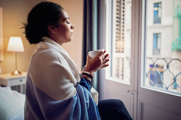 istock Depressed young woman standing sad in home 1223059839