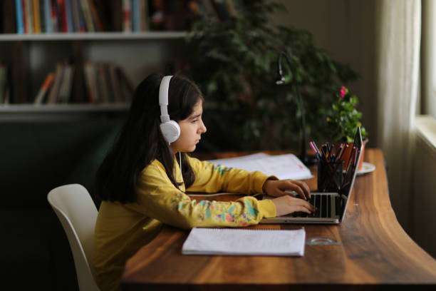 istock Schoolgirl watching online education class 1223060644