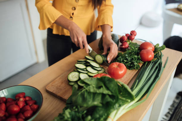istock Cutting vegetables and preparing a vegan meal 1223060785
