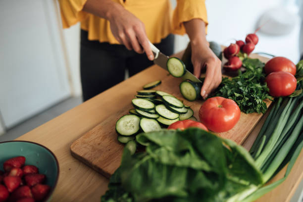 istock Cutting vegetables and preparing a vegan meal 1223060827
