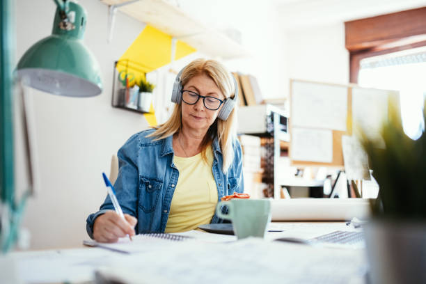 istock Mature woman working from home and drinking coffee 1223061050