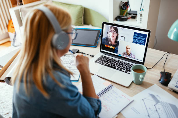 istock Teleconferencing - friends having video call during working hours 1223061109
