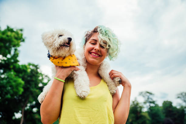 istock Young woman enjoying with her dog 1223061889