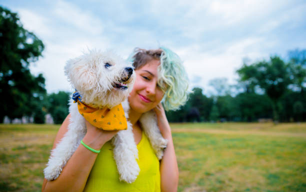istock Young woman enjoying with her dog 1223061918
