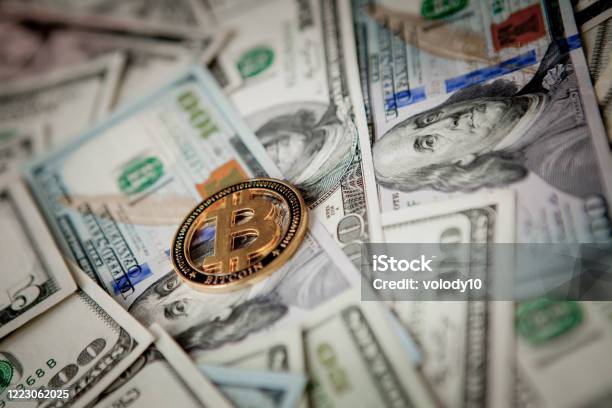 Golden Bitcoin On Us Dollar Bills Electronic Money Exchange Concept Stock Photo - Download Image Now