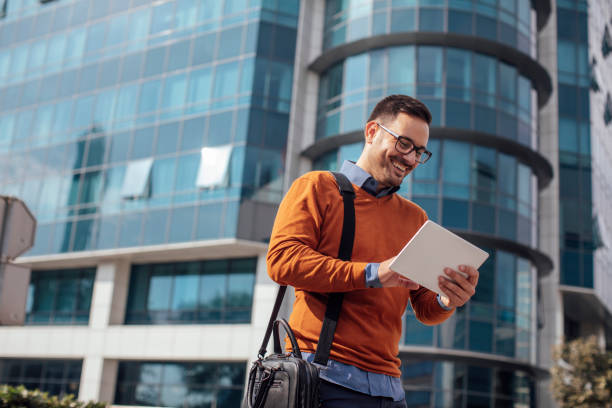 istock Successful Modern Young Businessman Using a Digital Tablet on the Street 1223064070