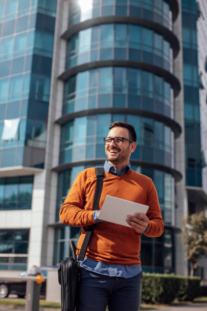 istock Successful Modern Young Businessman Using a Digital Tablet on the Street 1223064091