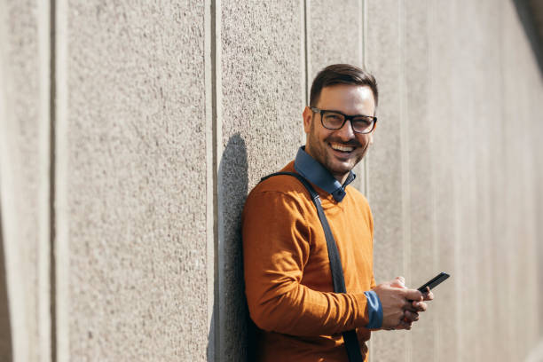 istock Online Business: Happy Businessman Working on the Street by Using his Smartphone 1223064143