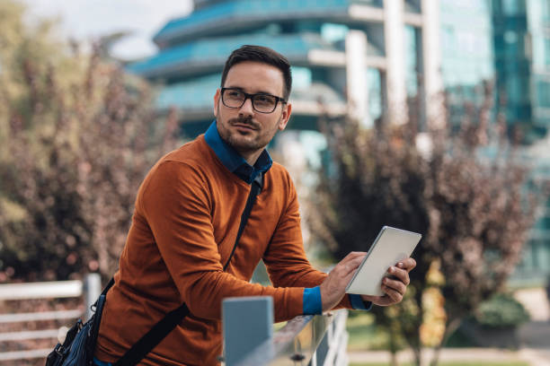 istock Successful Modern Young Businessman Using a Digital Tablet on the Street 1223064144