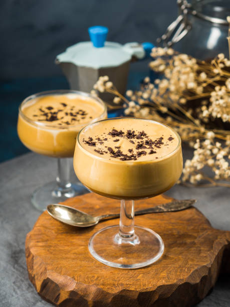 istock Frappe coffee in dessert glasses on brown backdrop 1223064441