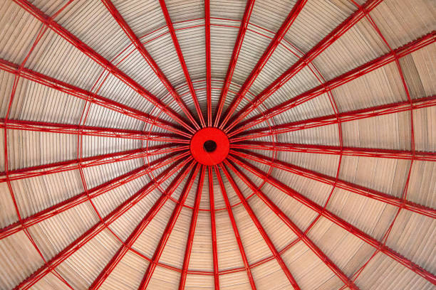 istock Circular pattern with wood and red metal supports 1223065513