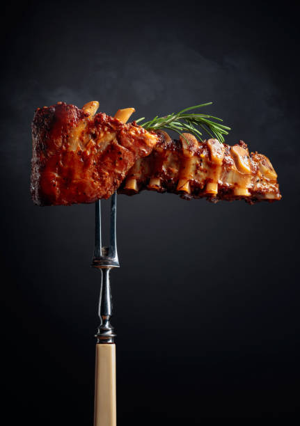 istock Grilled pork ribs with rosemary on a fork. 1223068228