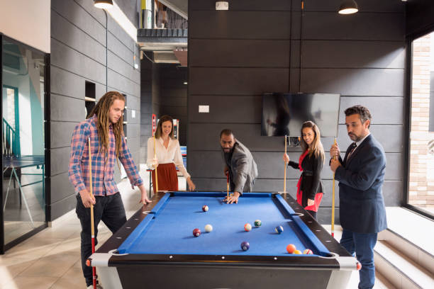istock Coworkers on their break playing pool 1223072916