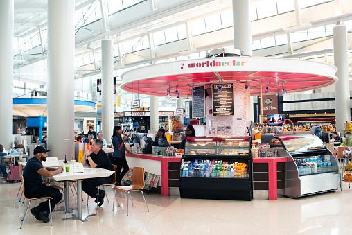 Newark, USA - May 11, 2017. Travelers dining at Newark International Airport, Newark, New Jersey, USA.