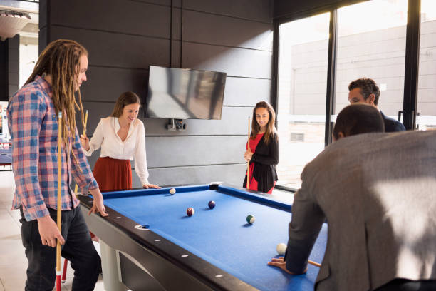 istock Coworkers on their break playing pool 1223075258