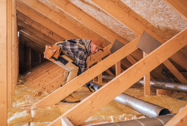 istock Male Contractor Installs Metal Pipe System In Attic. 1223080407
