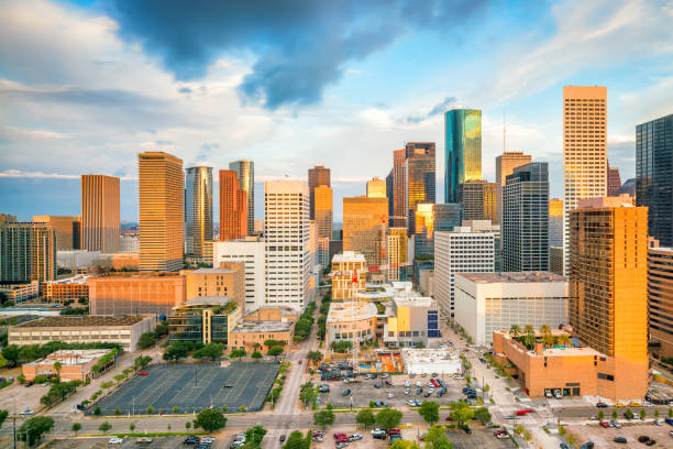 Downtown Houston skyline Downtown Houston skyline in Texas USA at twilight urban sprawl stock pictures, royalty-free photos & images